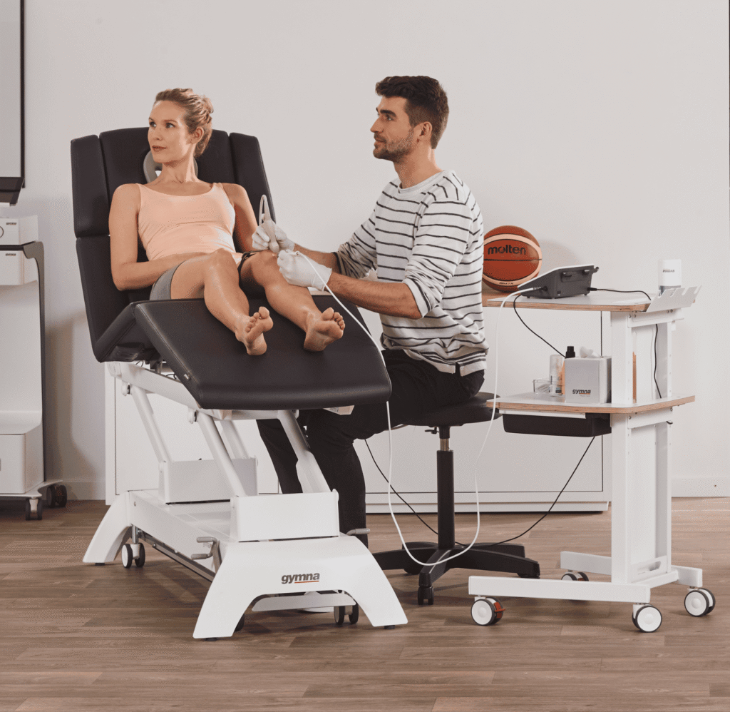 a patient being treated with electrolysis by a physiotherapist